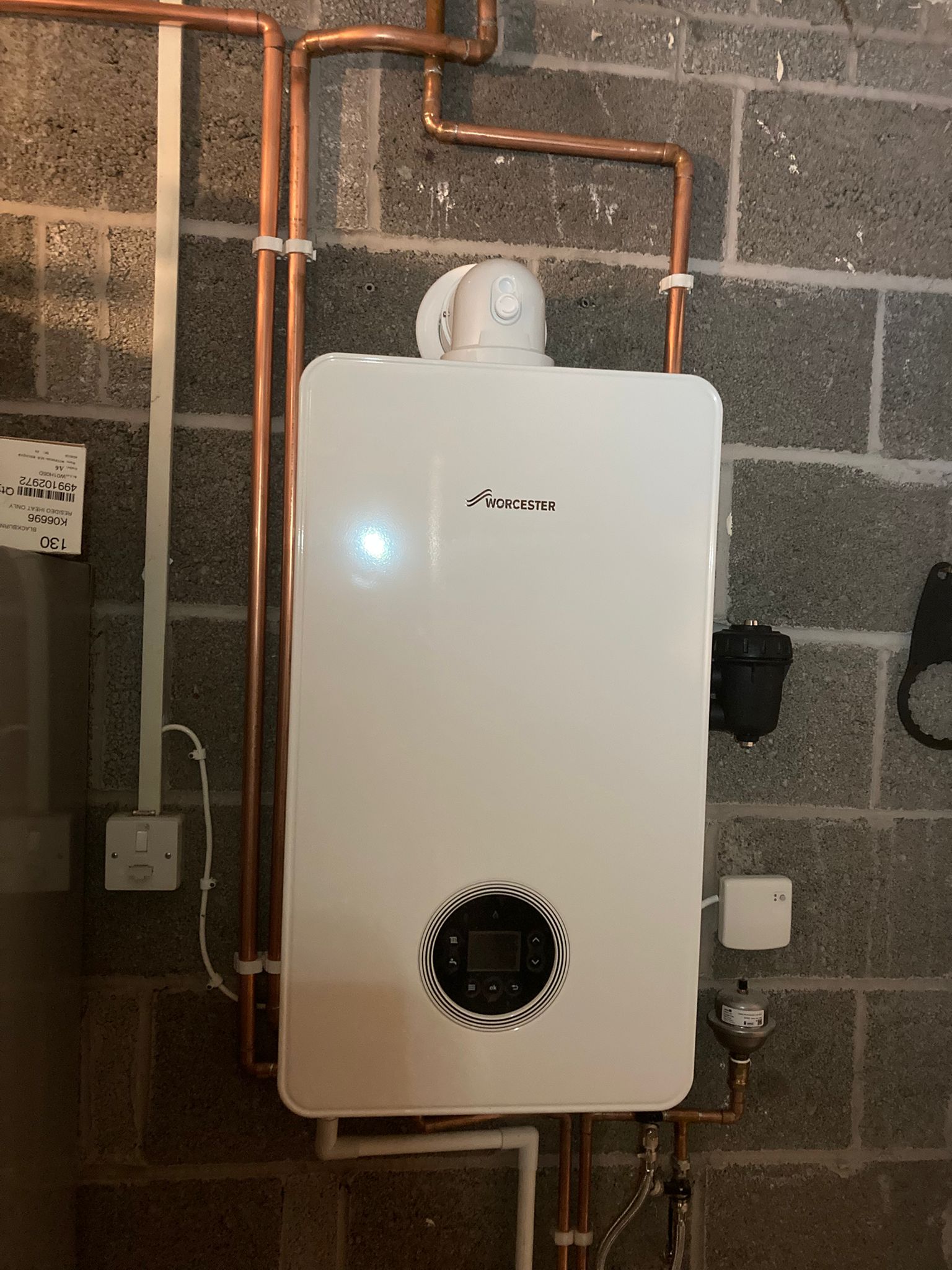 Worcester boiler fitted on block wall